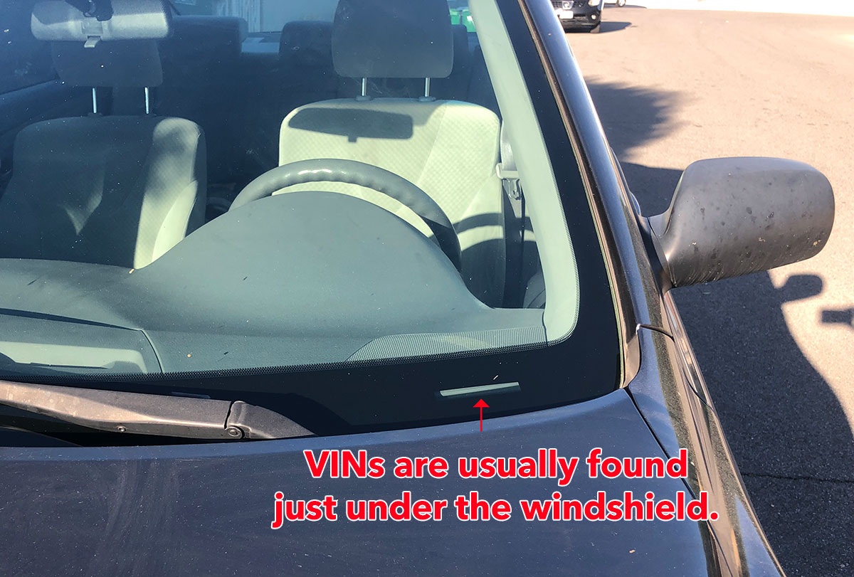 vins are found under windshield